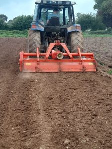 Robins Glen working to minimize soil disturbance when growing organic potatoes.